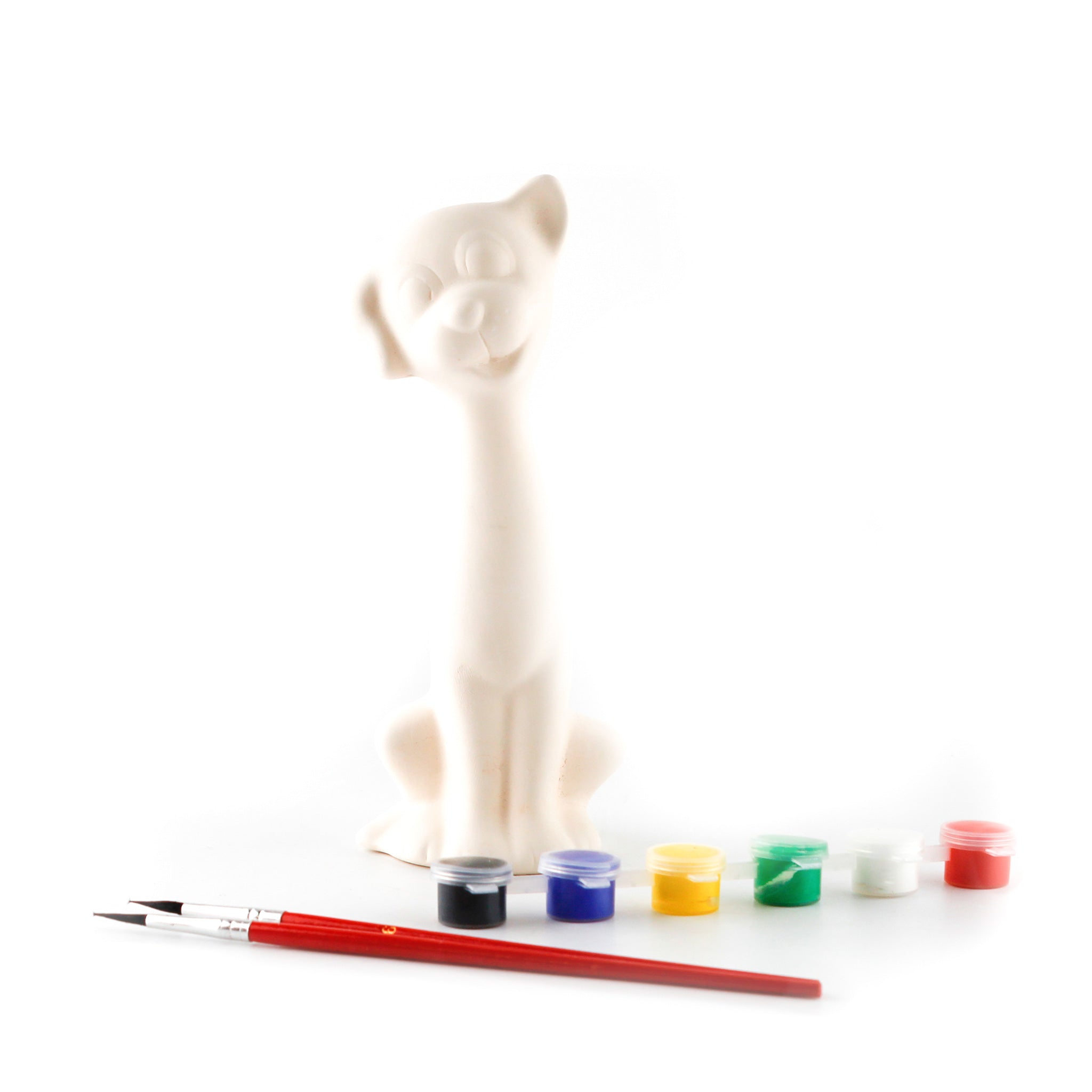 White ceramic dog with paints and brushes