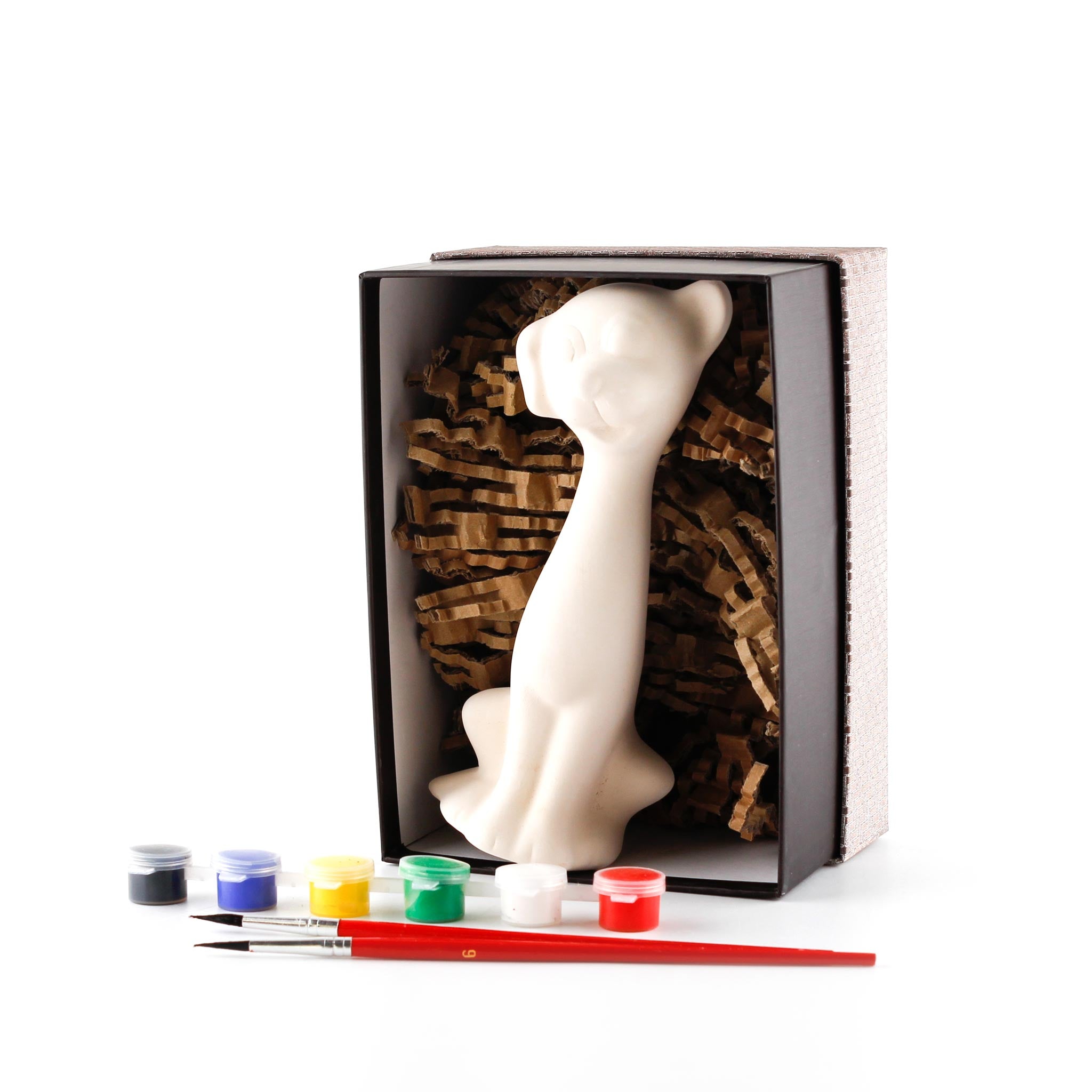 Ceramic dog in a sitting pose inside a paint your own gift box