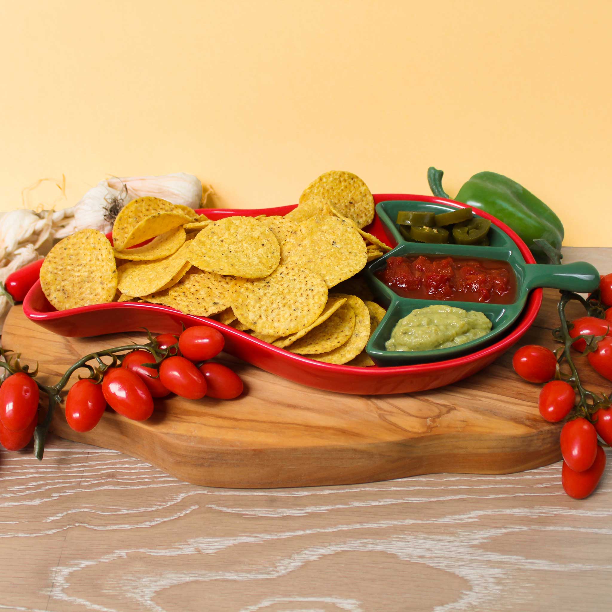 Red and Green chilli shaped dish filled with crisps and dips