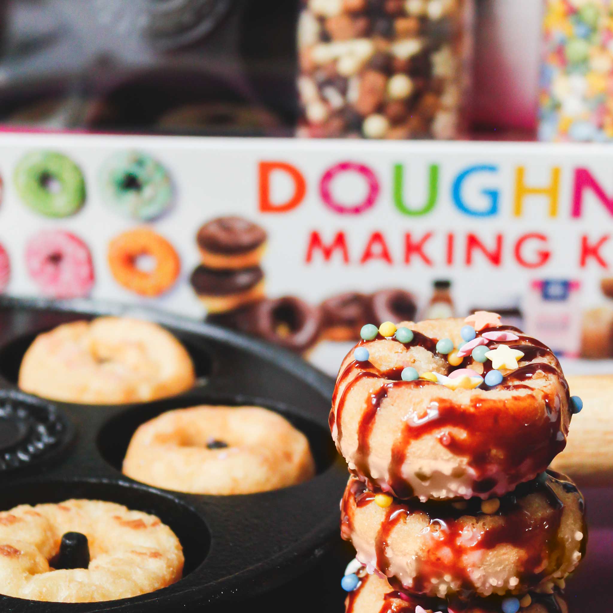 Decorated mini doughnuts with DIY kit behind