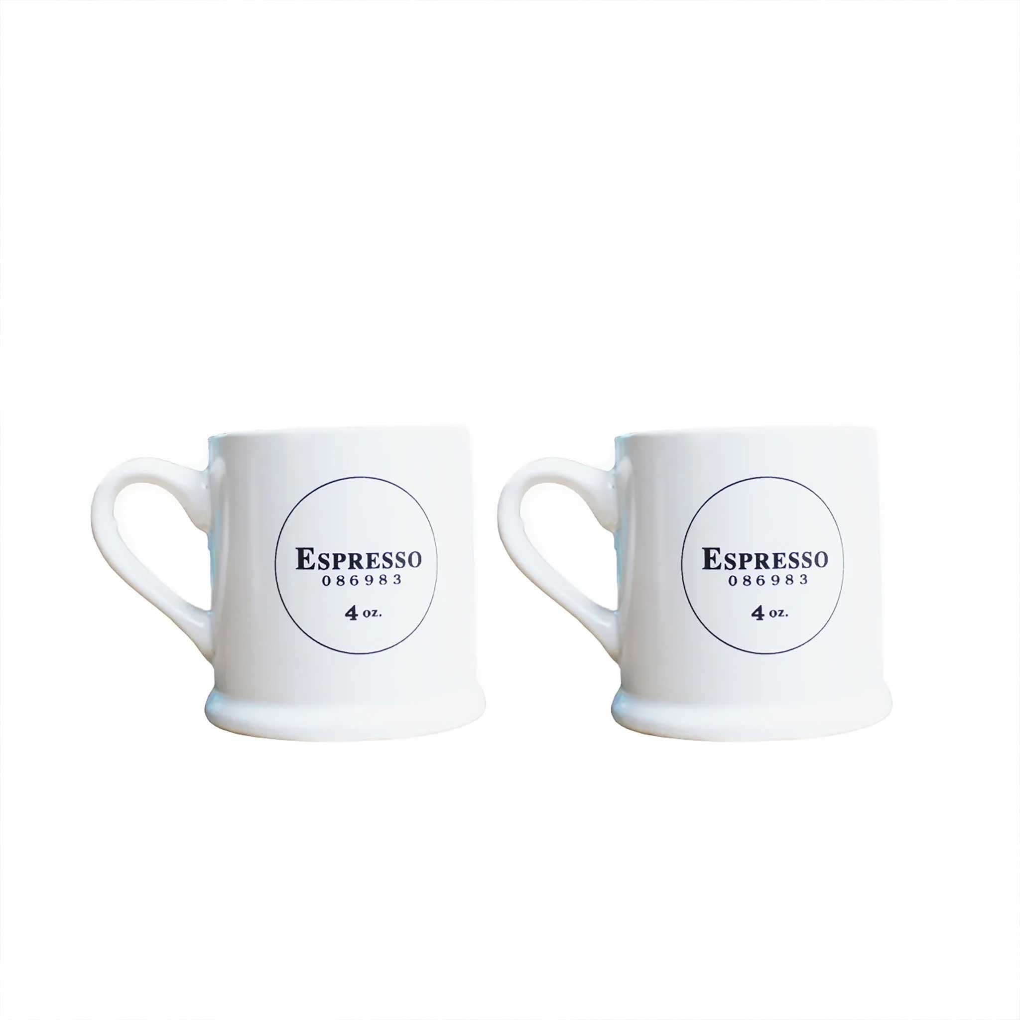 Two white espresso mugs with black detailed text from China Blue
